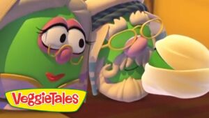 Two VeggieTales characters—green vegetables with glasses sharing a moment, logo visible in the corner.