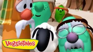 Group of VeggieTales characters posing on a sunny beach with the VeggieTales logo in the corner.