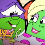Two smiling cartoon frogs—one purple with green face and the other green with blonde hair—lean in toward each other in a friendly moment, with bold “Larva” branding partially visible.