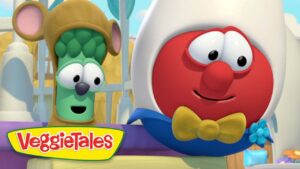 Cartoon VeggieTales characters: a red round figure with a white hood and yellow bow tie smiling, beside a green veggie in a brown helmet.