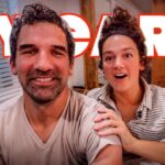 Smiling couple on a couch with bold red '5 YEARS' text overlay, suggesting an anniversary video.