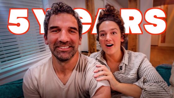 Smiling couple on a couch with bold red '5 YEARS' text overlay, suggesting an anniversary video.