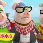 Three anthropomorphic pigs in colorful outfits pose together outdoors, VeggieTales logo at the bottom-left.