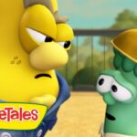 Two VeggieTales characters—one tall yellow figure with a worried expression and a green broccoli wearing a wide hat—talking outdoors in a sunny setting, with the VeggieTales logo visible in the corner.