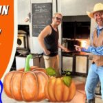 Two men in a blacksmith shop pose by a glowing forge; foreground pumpkins and a bright orange banner that says 'Fall Fun for Kids!' with a cartoon cowboy and 'Cowboy Jack' logo on the left.