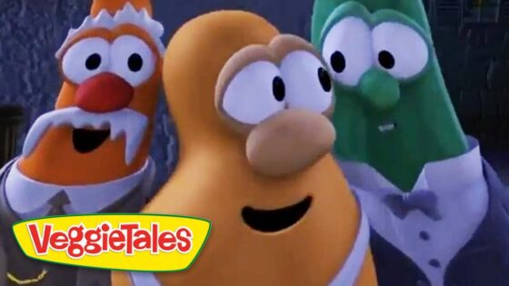 Three animated vegetables in tuxedos posing together, VeggieTales logo in the bottom-left corner.
