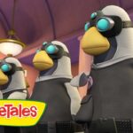 Three penguin-like characters wearing goggles stand in a colorful room, VeggieTales logo in the foreground, likely a scene from an episode.