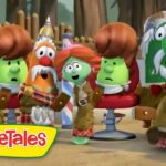 Group of VeggieTales characters seated in a theater audience, watching a performance, colorful veggies with curious expressions, VeggieTales logo visible in the corner.