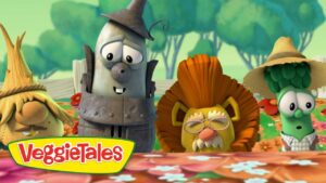 Animated VeggieTales characters stand behind a flower-filled table in a sunny garden; colorful logo in front.