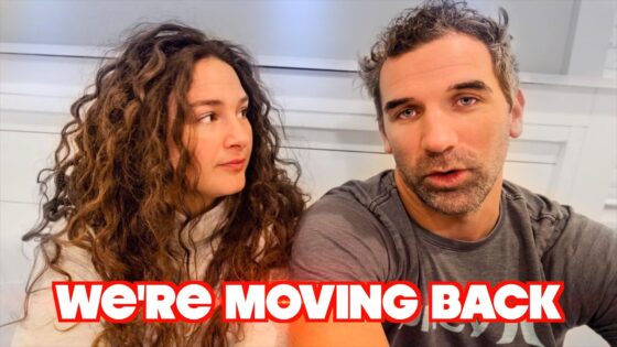 A man and a woman sit side by side, the woman gazing at him, with bold red text reading “WE'RE MOVING BACK” across the bottom.