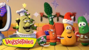 VeggieTales characters in Santa hats sharing plates at a holiday party, with a Christmas-themed backdrop and logo in the foreground.