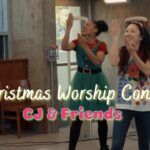 People dancing and clapping at a Christmas worship concert; text 'CJ & Friends' overlayed on the image.