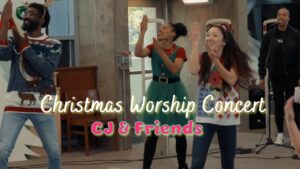 People dancing and clapping at a Christmas worship concert; text 'CJ & Friends' overlayed on the image.