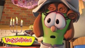 Green VeggieTales character with a hat and surprised expression in a kitchen, VeggieTales logo in the foreground.