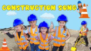 Five children in orange safety vests and blue hard hats pose on a sandy construction site with a bright blue sky and the words 'CONSTRUCTION SONG' above them.