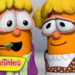 Two carrot-shaped VeggieTales characters with blonde hair smile at each other, one wearing a headset, logo visible at the bottom left.