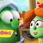 Two VeggieTales vegetables gaze at each other with a warm, loving vibe; 'VeggieTales' logo in the corner and red heart graphics overlaying the scene.