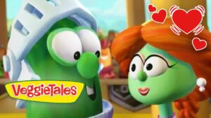 Two VeggieTales vegetables gaze at each other with a warm, loving vibe; 'VeggieTales' logo in the corner and red heart graphics overlaying the scene.