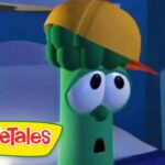 Green veggie character from VeggieTales wearing a yellow hard hat, looking surprised in a blue scene.