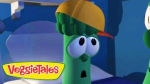 Green veggie character from VeggieTales wearing a yellow hard hat, looking surprised in a blue scene.