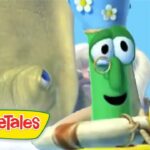 Green VeggieTales character with a flowered hat on a boat, smiling at a yellow duck; VeggieTales logo in the corner.