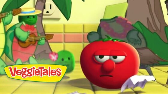 Red tomato character with a sad, tired expression sits on a yellow-tiled floor, a guitar-playing green veggie in a straw hat behind, VeggieTales logo in the corner.