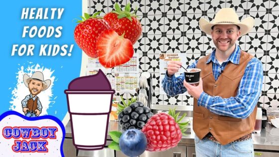 Promotional thumbnail with a cowboy-themed host holding a cup, oversized strawberries and berries, and bold text 'Healthy Foods for Kids' on a blue background.