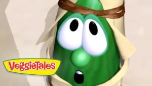 Green VeggieTales character with wide, surprised eyes and open mouth, wrapped in beige bandages or cloth, VeggieTales logo in the lower-left corner.