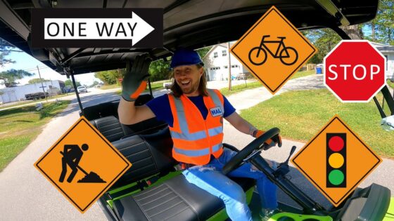 Safety-vested worker driving a small vehicle with multiple orange road-sign overlays (construction, cyclist, stop, traffic light, one-way).