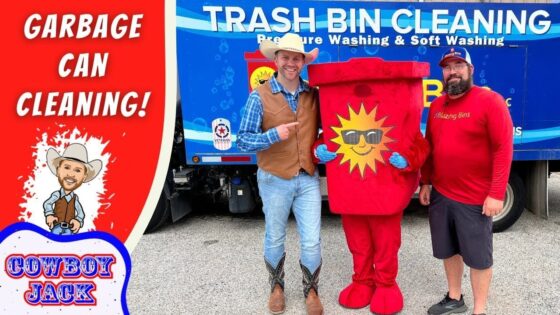 Promo photo for garbage can cleaning service with two men in western outfits posing with a red sun-logo trash can mascot in front of a blue Trash Bin Cleaning truck, promoting the service.