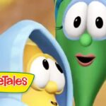 Cartoon green vegetable with large eyes and pink lips beside a yellow vegetable wearing a blue hood; VeggieTales logo in the corner.