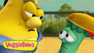 Two VeggieTales characters—one yellow and grumpy on the left, one green and puzzled on the right—gaze at each other in a sunny outdoor setting, with the VeggieTales logo visible at the bottom left.