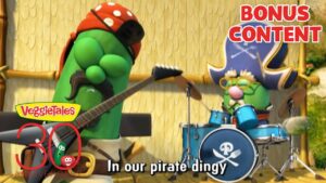 VeggieTales characters perform pirates-themed music on stage; band with cucumber playing guitar and another at drums, 'BONUS CONTENT' text overlays.