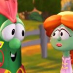 Two VeggieTales characters, a green veggie with pink hairpiece and a green-skinned girl with orange braided hair, chat outdoors next to a 30th anniversary logo.