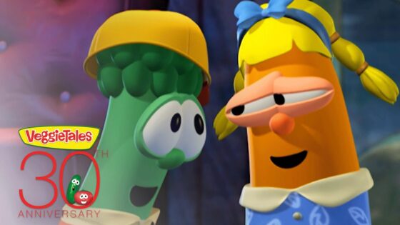 Two VeggieTales characters—a green cucumber wearing a yellow helmet and an orange carrot with a blue bow—smile at each other; VeggieTales 30th Anniversary logo in the corner.