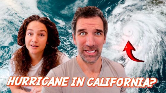 Two people look surprised in front of a satellite image of a hurricane near California, with a red arrow pointing to the storm.