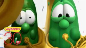 VeggieTales celebration image showing two green cucumber characters with a 30th anniversary badge in the corner.