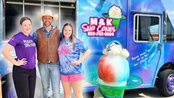 Three people—a man wearing a cowboy hat and vest, and two girls—pose smiling in front of a colorful Sno-Cones truck with a cotton-candy ice-cream sculpture in the foreground
