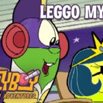 Two bright cartoon characters at a desk, one with red headphones and the other wearing a crown, under the caption 'LEGO MY EGO!' (LarryBoy: The Cartoon Adventures logo visible).