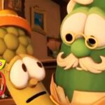 Close-up of VeggieTales characters—a green vegetable with glasses and a mustache beside a yellow, worried-looking veggie—with a VeggieTales 30th Anniversary logo in the foreground.