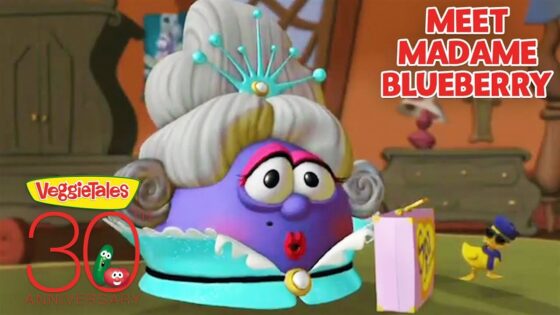 Madame Blueberry from VeggieTales wearing a turquoise necklace, looking surprised, with a pink gift box; 'Meet Madame Blueberry' title and a 30th anniversary logo.