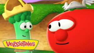 Cartoon broccoli wearing a crown talks to a red tomato character; VeggieTales logo visible in corner on a colorful background.