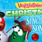 VeggieTales Christmas Sing-Along Songs cover featuring Bob the Tomato in a top hat and Larry the Cucumber in a plaid hat against a snowy blue background with snowflakes and ornament