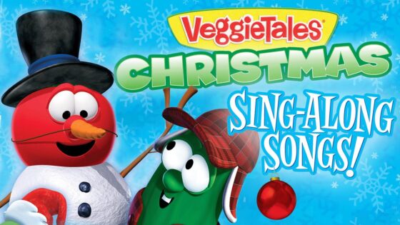 VeggieTales Christmas Sing-Along Songs cover featuring Bob the Tomato in a top hat and Larry the Cucumber in a plaid hat against a snowy blue background with snowflakes and ornament