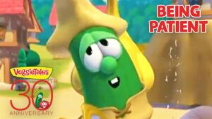 VeggieTales character (green veggie) in a yellow hood with 'Being Patient' text and a 30th Anniversary VeggieTales badge.