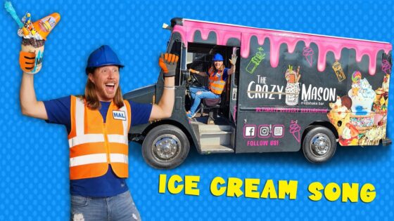 Man in orange safety vest and blue hard hat holds a huge toy ice cream cone, excited pose, against a blue dotted backdrop.