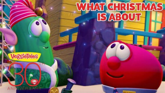 VeggieTales Christmas thumbnail featuring a green elf-like veggie and a pink round veggie smiling at each other in a colorful set, with the text 'What Christmas Is About' and a 30th anniversary badge.