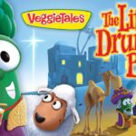 VeggieTales poster for 'The Little Drummer Boy' showing a green veggie drummer, a white-sheep character, camels, and other colorful VeggieTales figures.