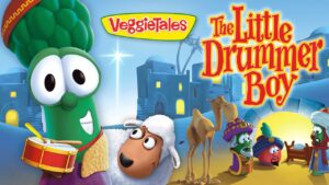 VeggieTales poster for 'The Little Drummer Boy' showing a green veggie drummer, a white-sheep character, camels, and other colorful VeggieTales figures.