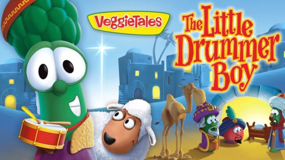 VeggieTales poster for 'The Little Drummer Boy' showing a green veggie drummer, a white-sheep character, camels, and other colorful VeggieTales figures.
